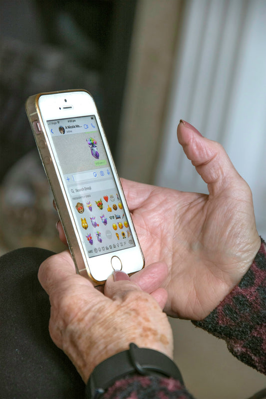 person holding silver iphone 6